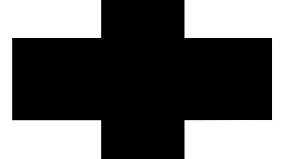 Ein schwarzes Kreuz auf weißem Hintergrund. Es symbolisiert oft medizinische Hilfe oder Notfallservices.